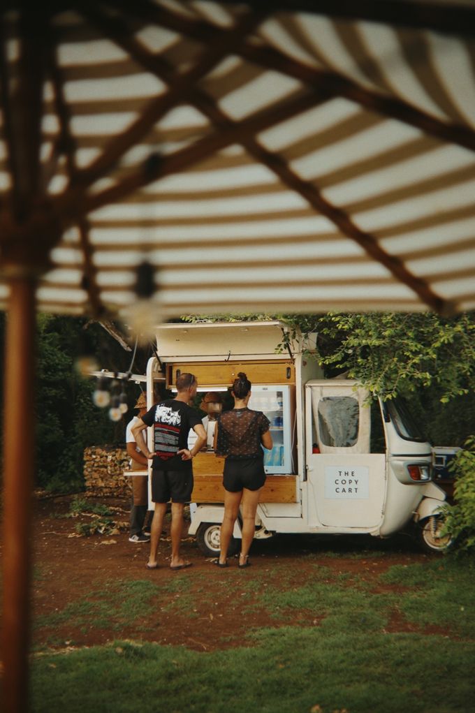 Coffee tuk-tuk framed by a striped parasol
